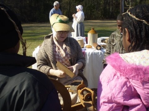 Backcountry woman carding at encampment